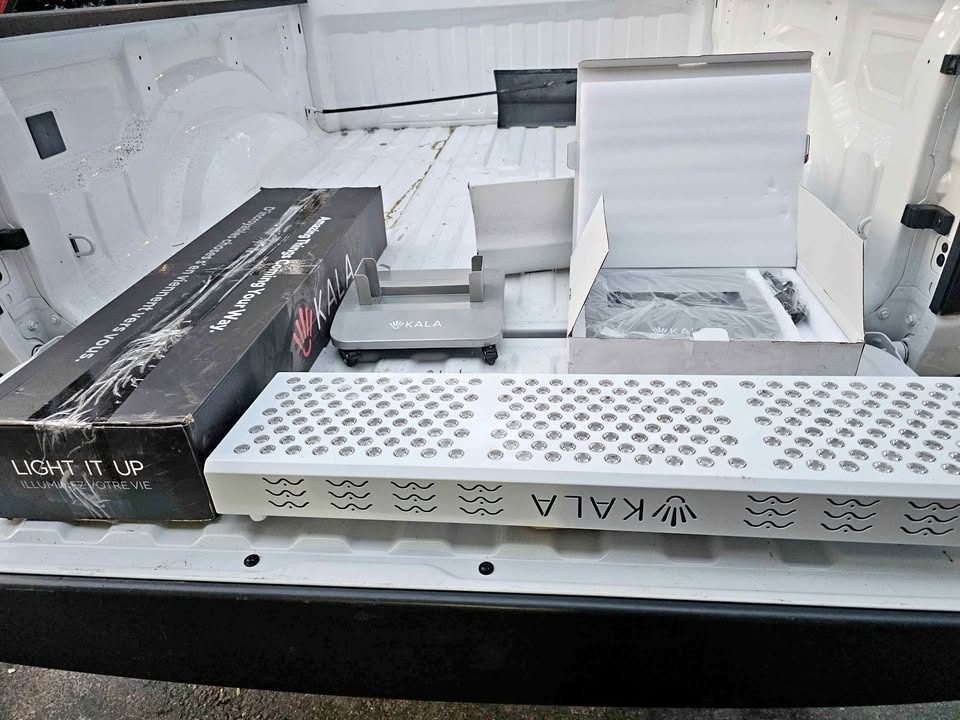 Unboxing the Kala Elite Panel and rolling base stand in truck bed