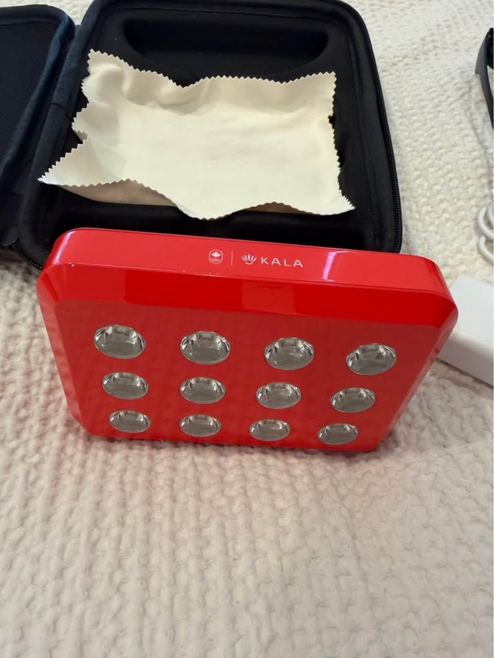 Front view of Kala Mini 2.0 showing 12 optical lenses and Canadian Olympic branding