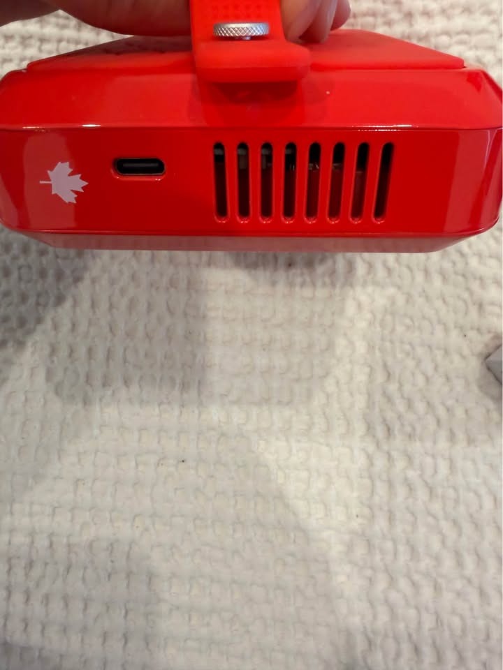USB-C charging port and Canadian Maple leaf emblem