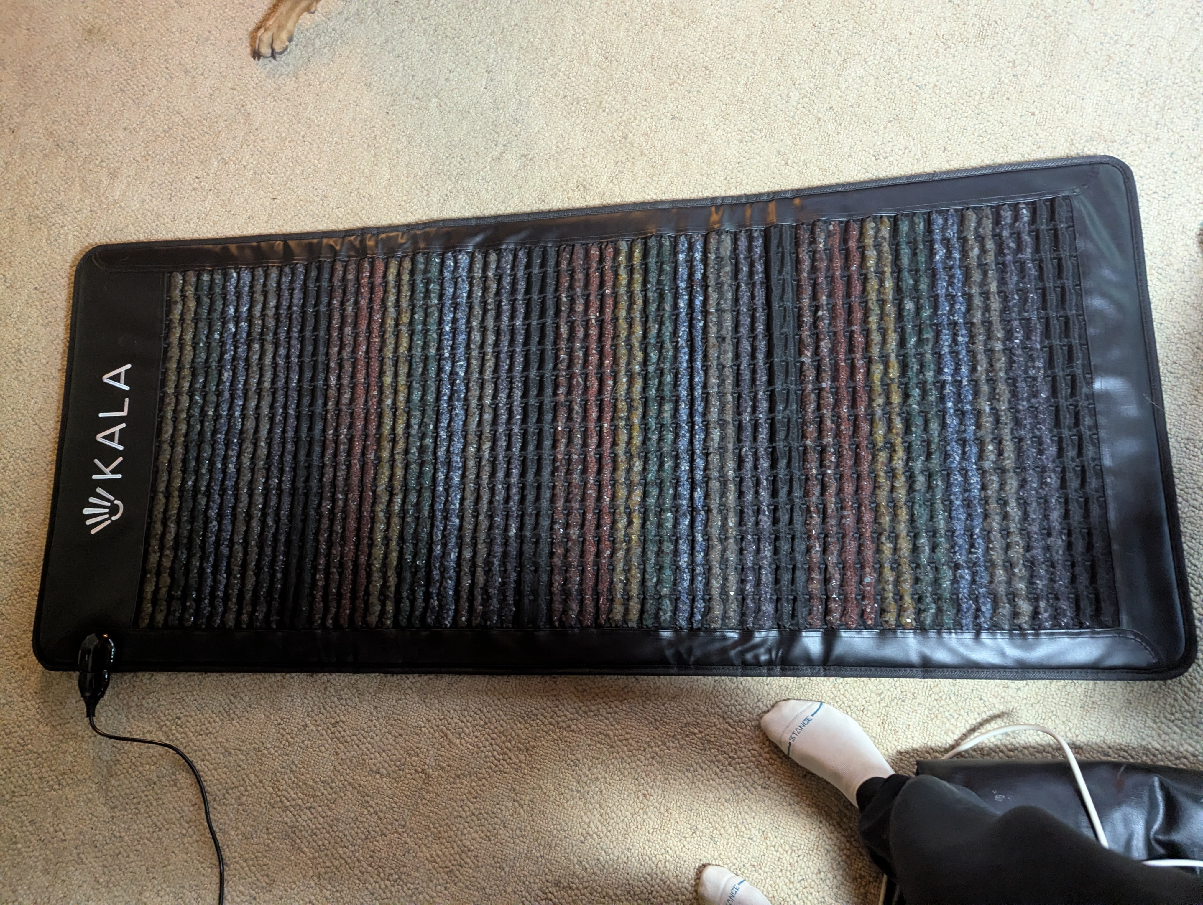 Kala PEMF Mat rolled up in storage case